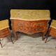 Louis XV style commode with marquetry and its pair of bedside tables.