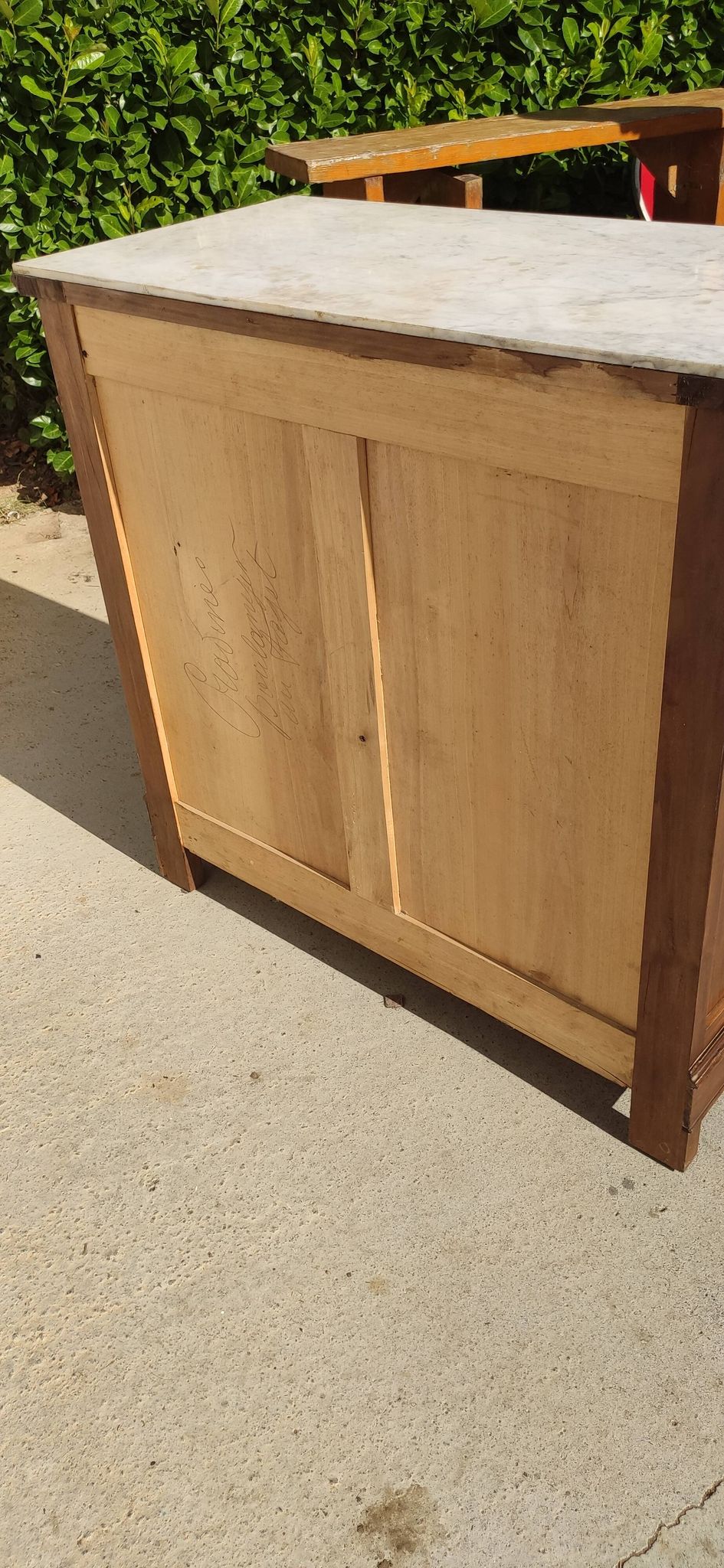 Old chest of drawers with white marble.
