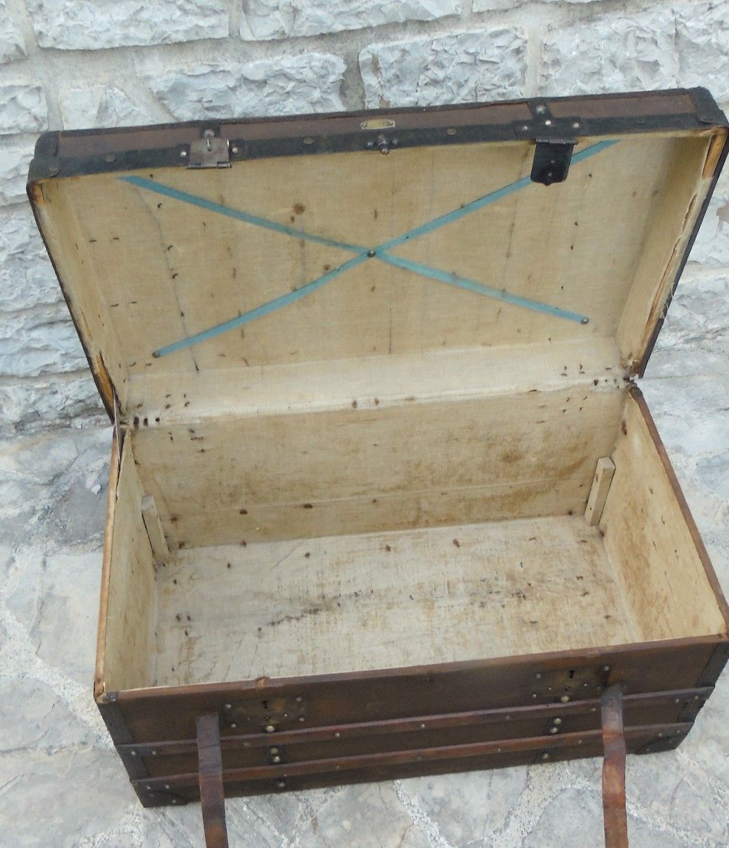 Old wooden and leather trunk, old brass nail trunk and leather strap