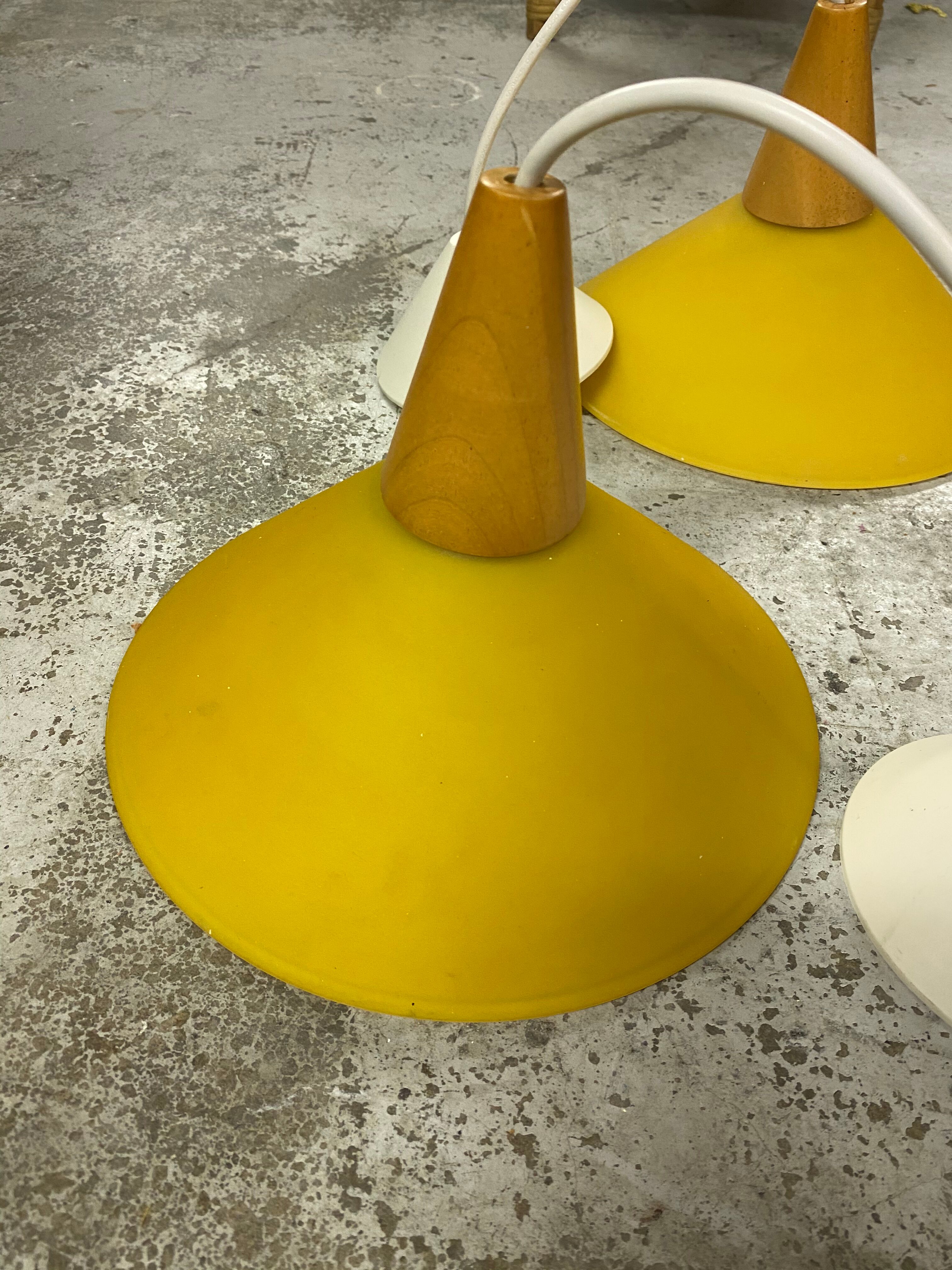 Duo of yellow glass pendant lamps