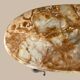 Table basse ovale en onyx et laiton 1950