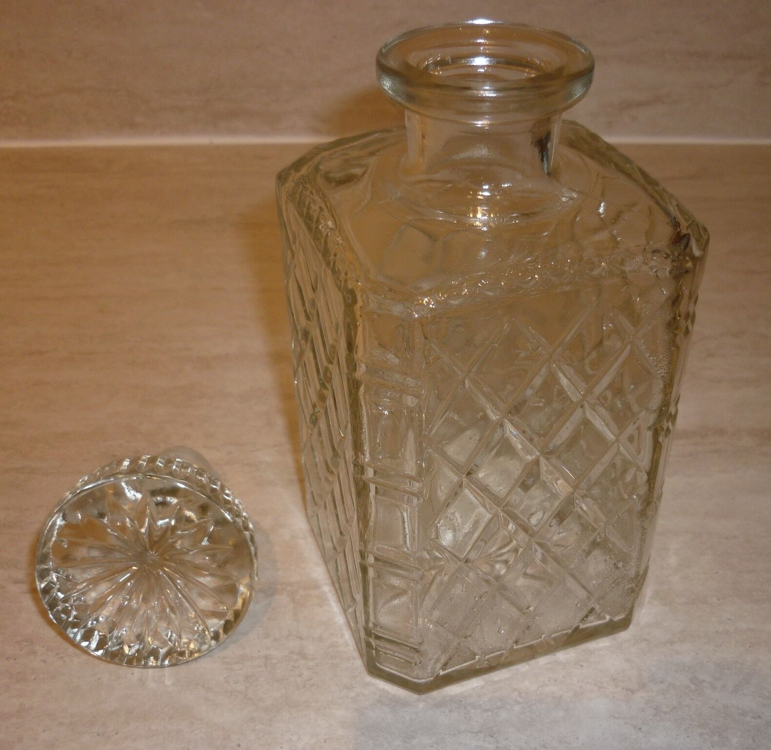 Antique whisky decanter made of chiseled glass