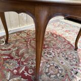 Round oak dining table with leather in Louis XV style.