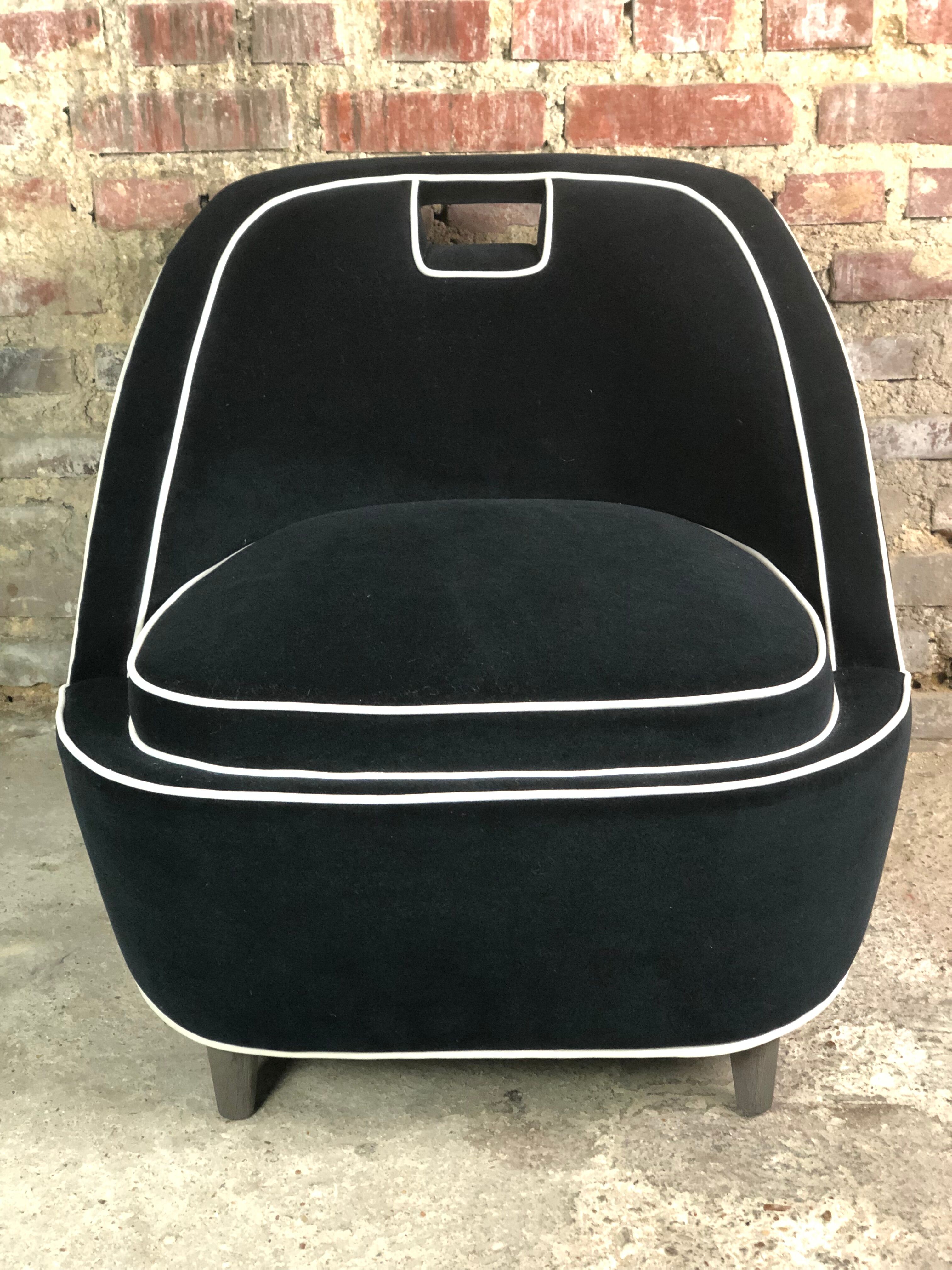 Retro vintage 80's armchair in black velvet with white trim
