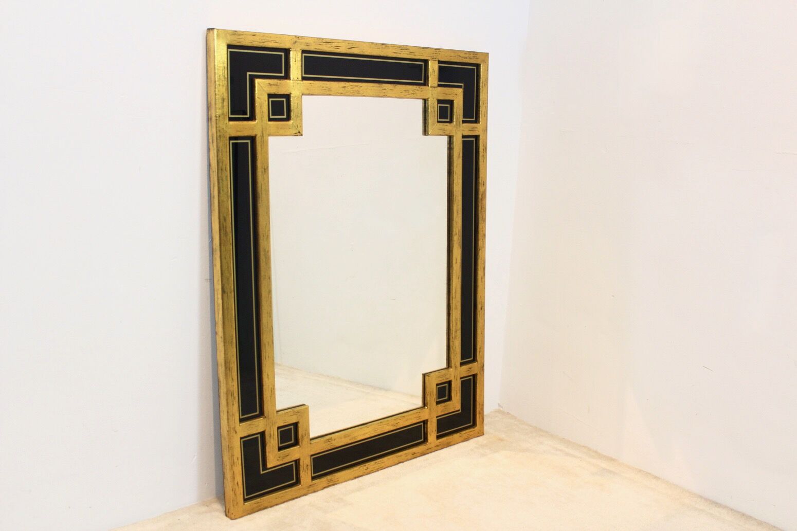 Mirror in gilded wood and black glass by Deknudt Belgium