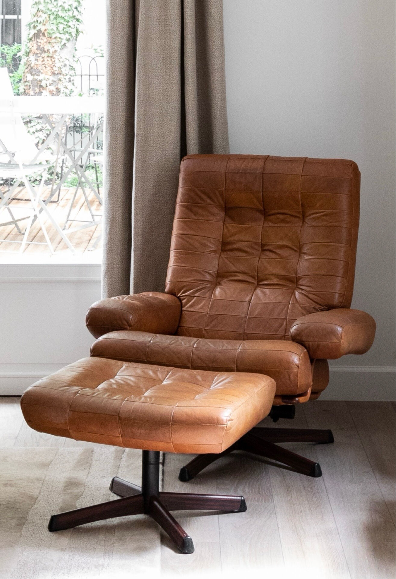 Armchair and footrest in leather