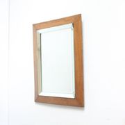 Art deco beveled mirror in an oak frame, 1940s.