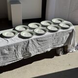 Set of 9 vintage turquoise deep plates with gold trim and pink flowers.