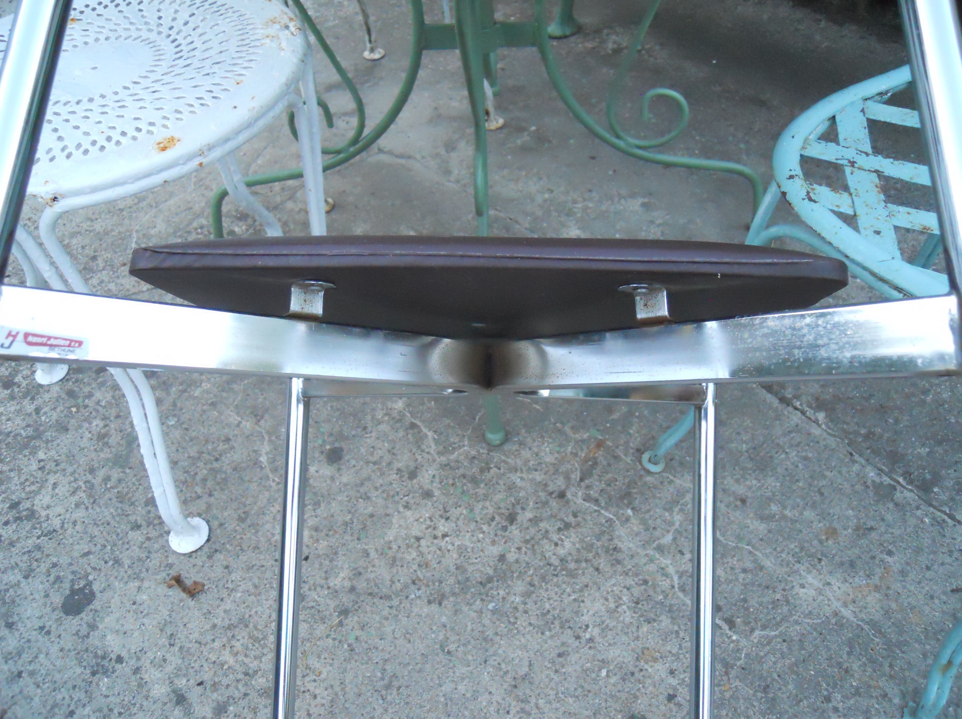 Vintage chrome metal chair and faux black leather