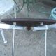 Vintage chrome metal chair and faux black leather