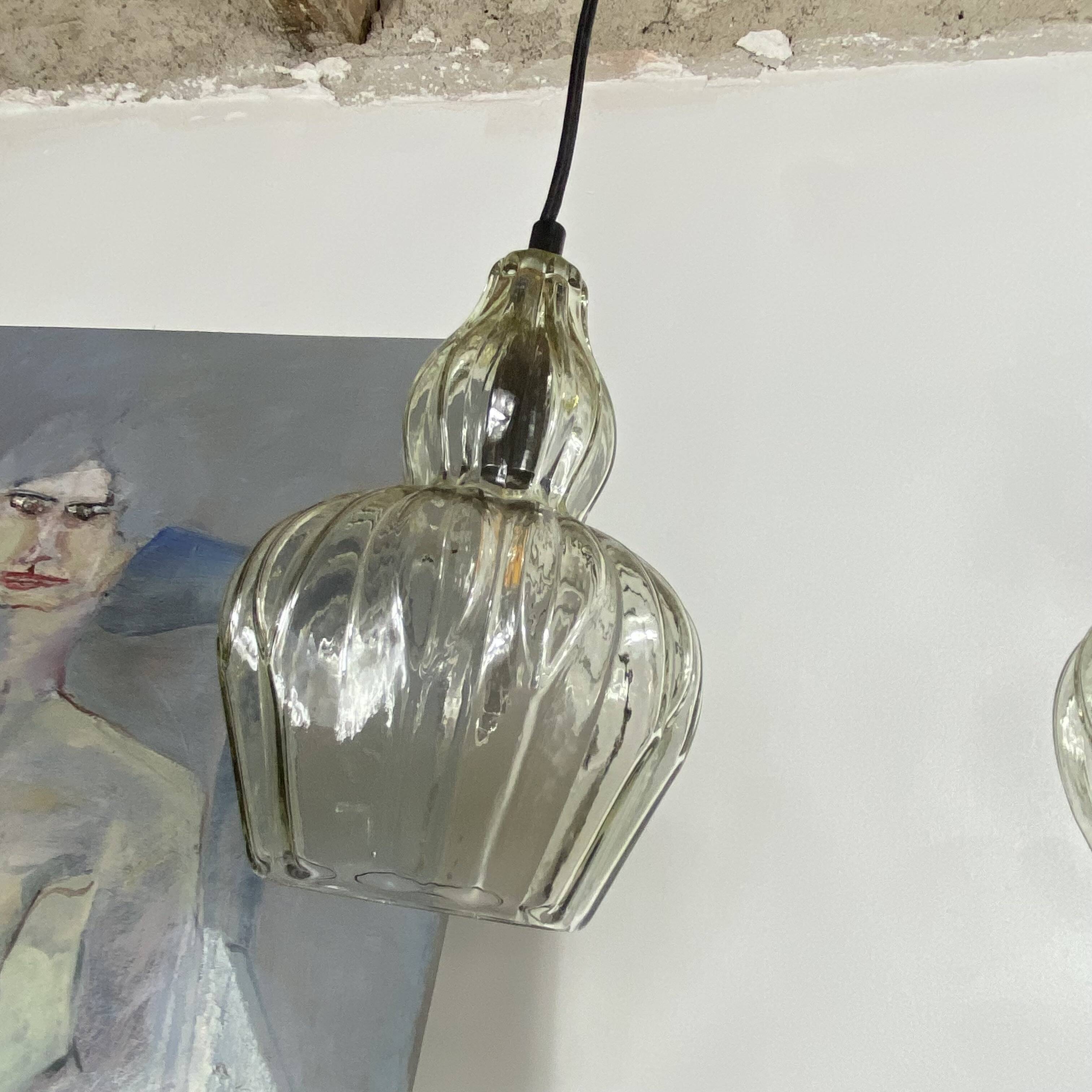 Pair of vintage glass pendant lights.