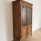 Antique display cabinet in Louis XV style made of wood.