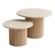 Round nesting coffee table in travertine and raw fluted wood.