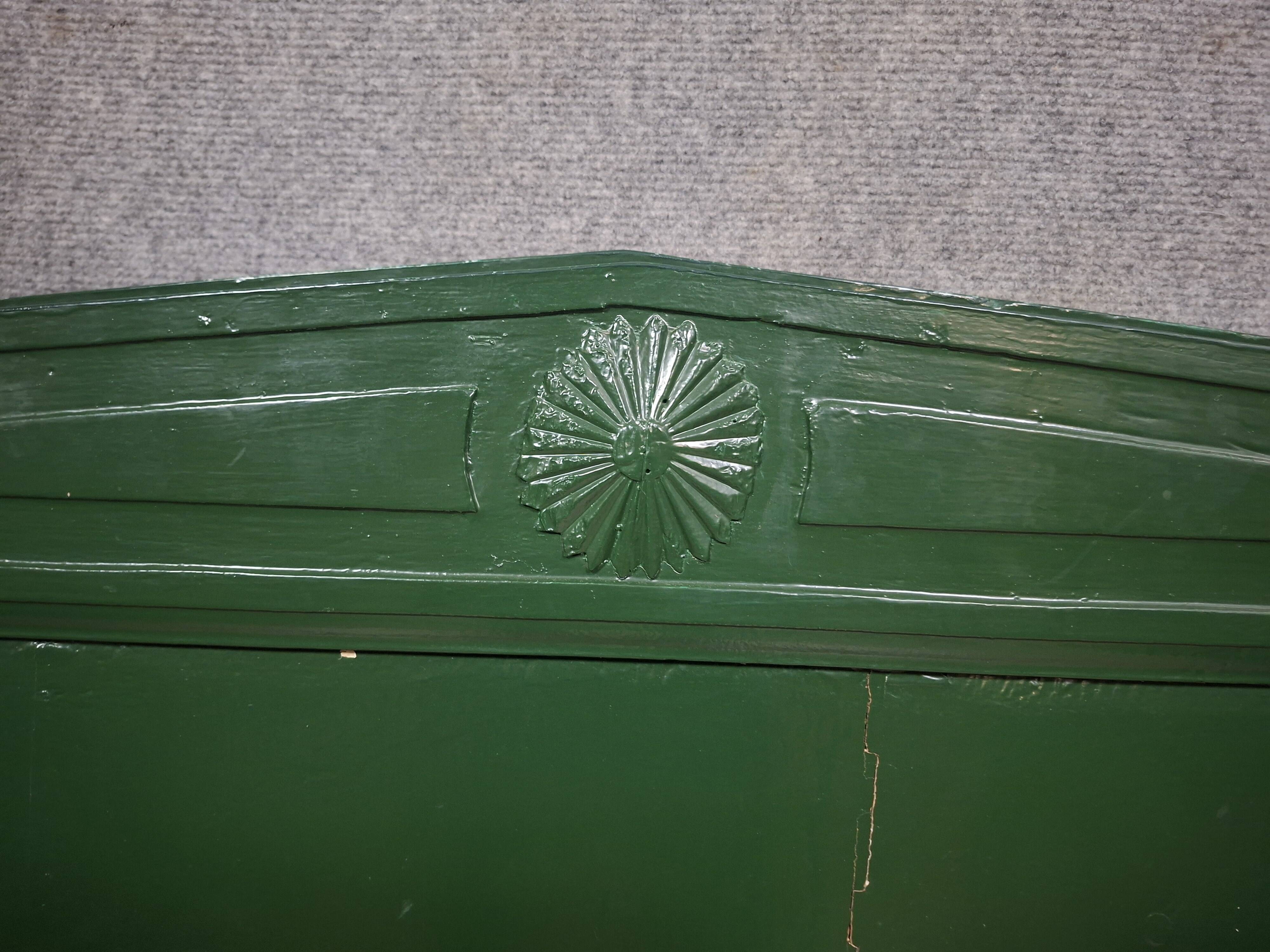 Directoire style bed in painted green wood.