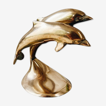 Duo of brass dolphins