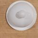 White porcelain butter dish accompanied by its matching bell.