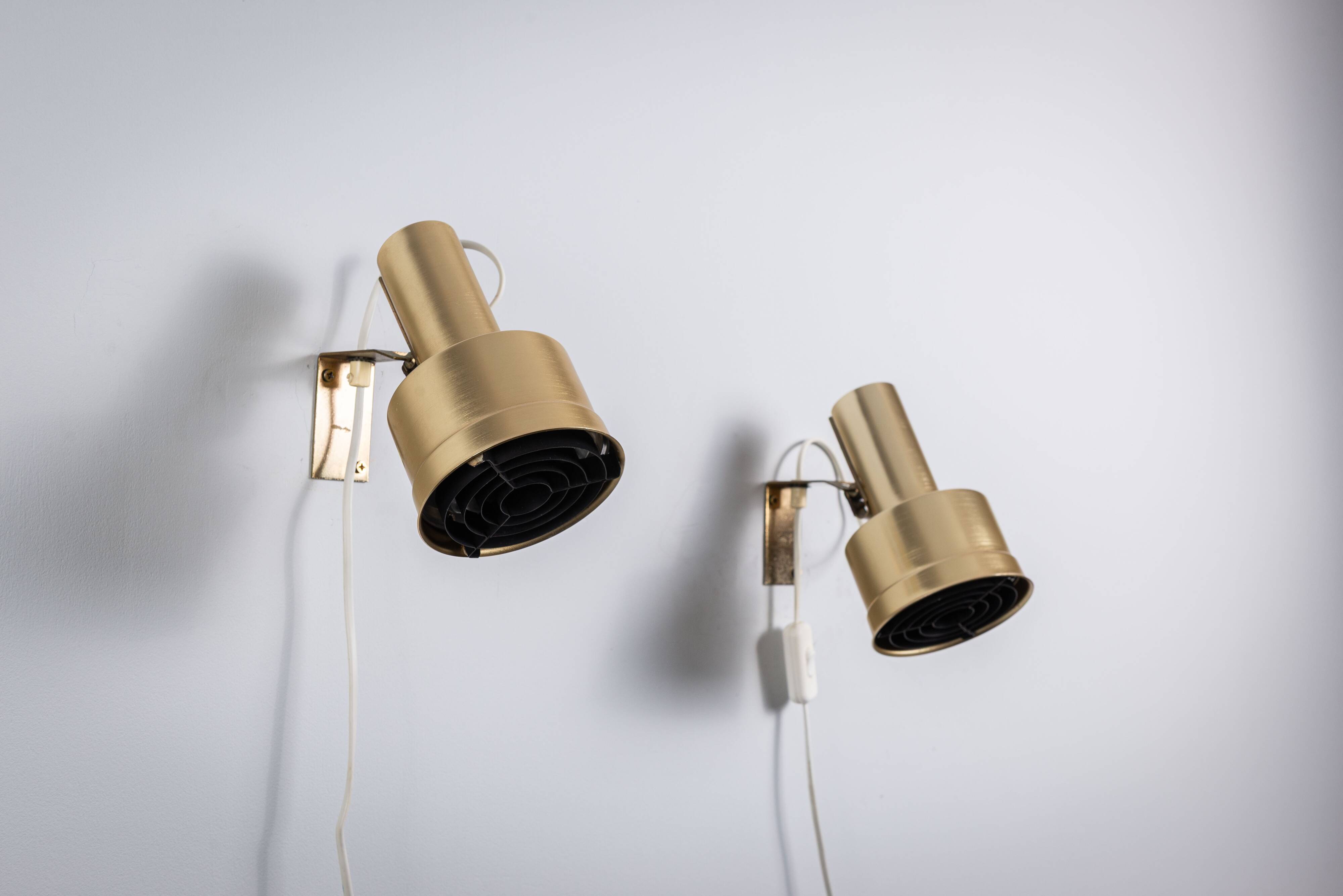 Pair of adjustable wall lamps designed by Per Sundstedt for Kosta Lampan