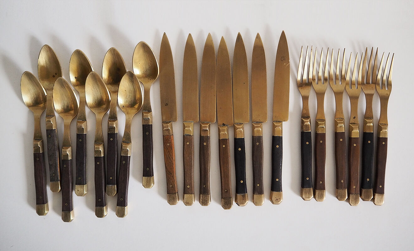 Set of old dessert cutlery in wood and brass