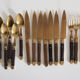Set of old dessert cutlery in wood and brass