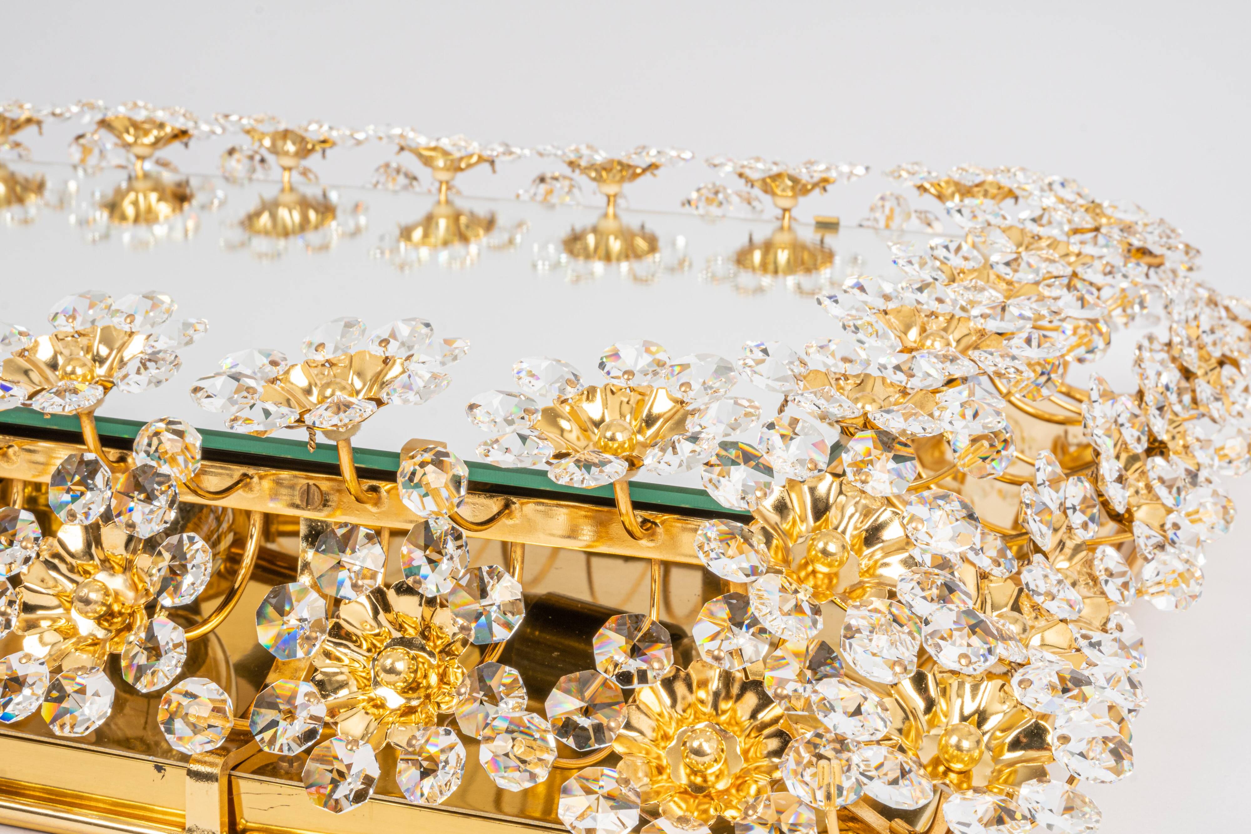 Spectacular backlit mirror in gilded brass and crystal glass by Palwa, Germany.