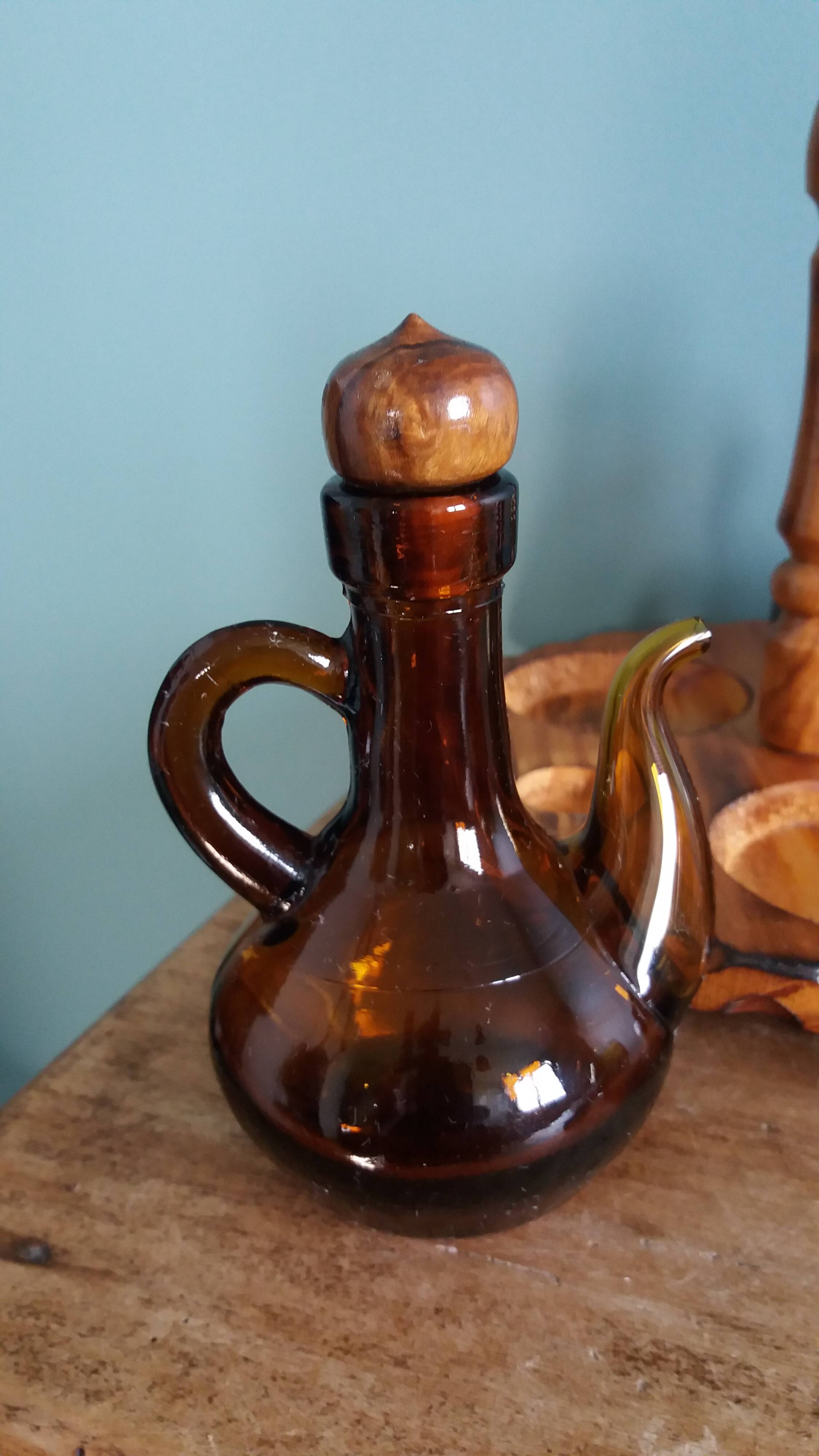 Oil, vinegar, mustard, pepper, salt, olive wood servant from Spain.