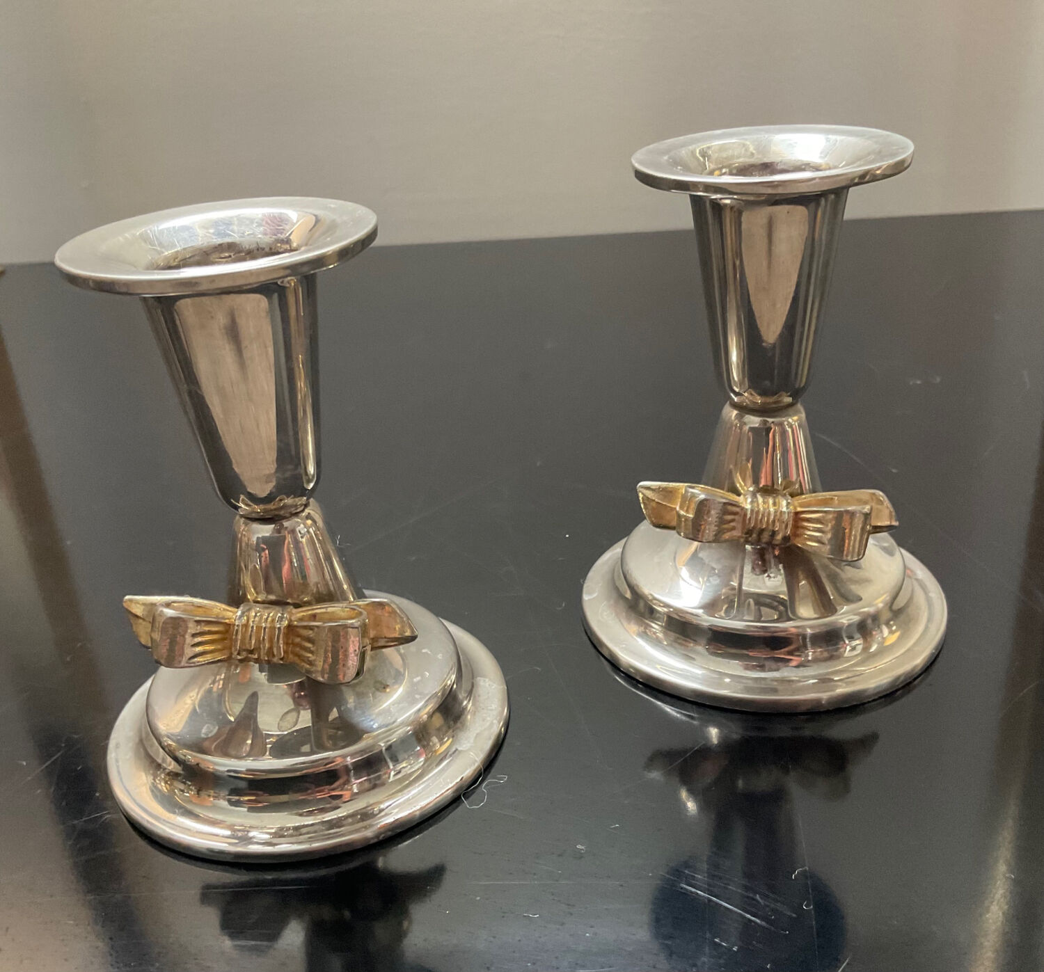 Pair of vintage candle holders in silver metal and brass