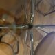Smoked glass round table and chrome foot
