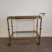 Desserte roulante en laiton doré et verre