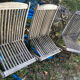 Folding garden chairs and armchairs in River Han dowelled teak.