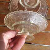 Duo of molded glass display cups, arabesque décor