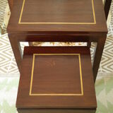 Pull-out tables in mahogany and vintage brass