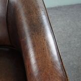 Dark sheep leather club armchair, sleek design