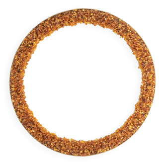Circular and backlit mirror in amber. Contemporary artist's work.