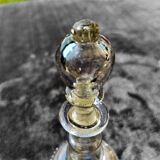 Enamelled decanter with its cap