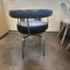 LC7 Swivel Armchair in black leather by Charlotte Perriand for Cassina