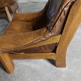 Armchairs in leather and vintage wood 70's