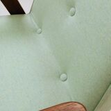 Pastel pistachio wool fabric Scandinavian armchair, oak wood.