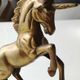 of greenhouse art deco bookends recancing unicorns. solid brass