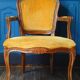 Velvet cabriolet armchair with decorative copper studs.
