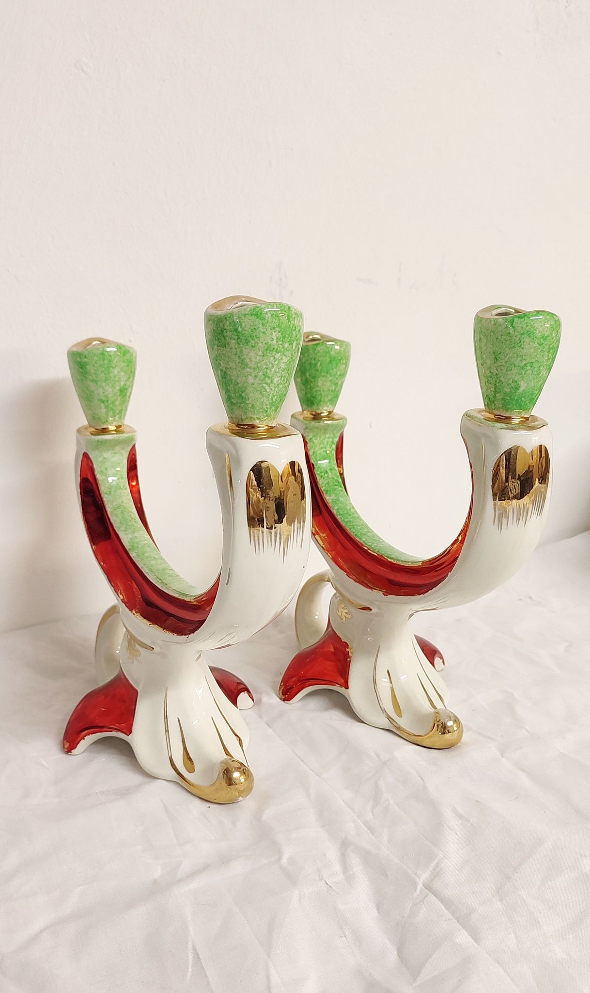Painted ceramic chandeliers. France, 1950s.