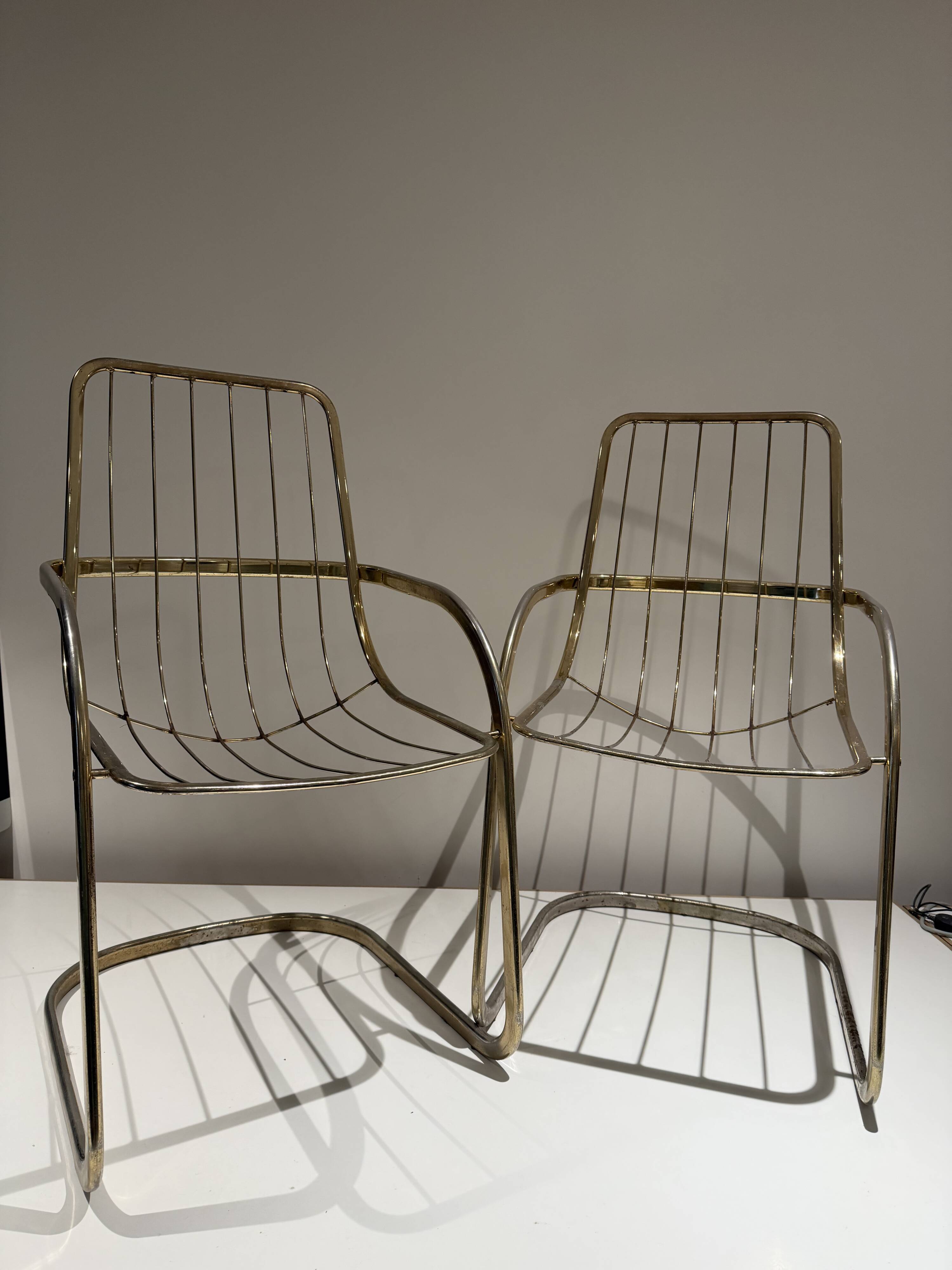 Pair of Willy Rizzo armchairs in gold metal