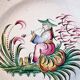 Antique ceramic or earthenware plate from the 19th century, Chinese style decoration