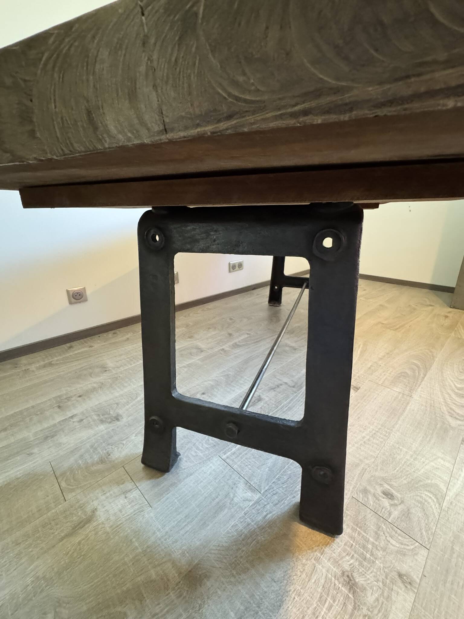 Industrial style table with a mahogany top.