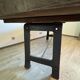 Industrial style table with a mahogany top.
