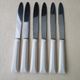 Set of 6 vintage Pradel 255 stainless steel and white bakelite table knives