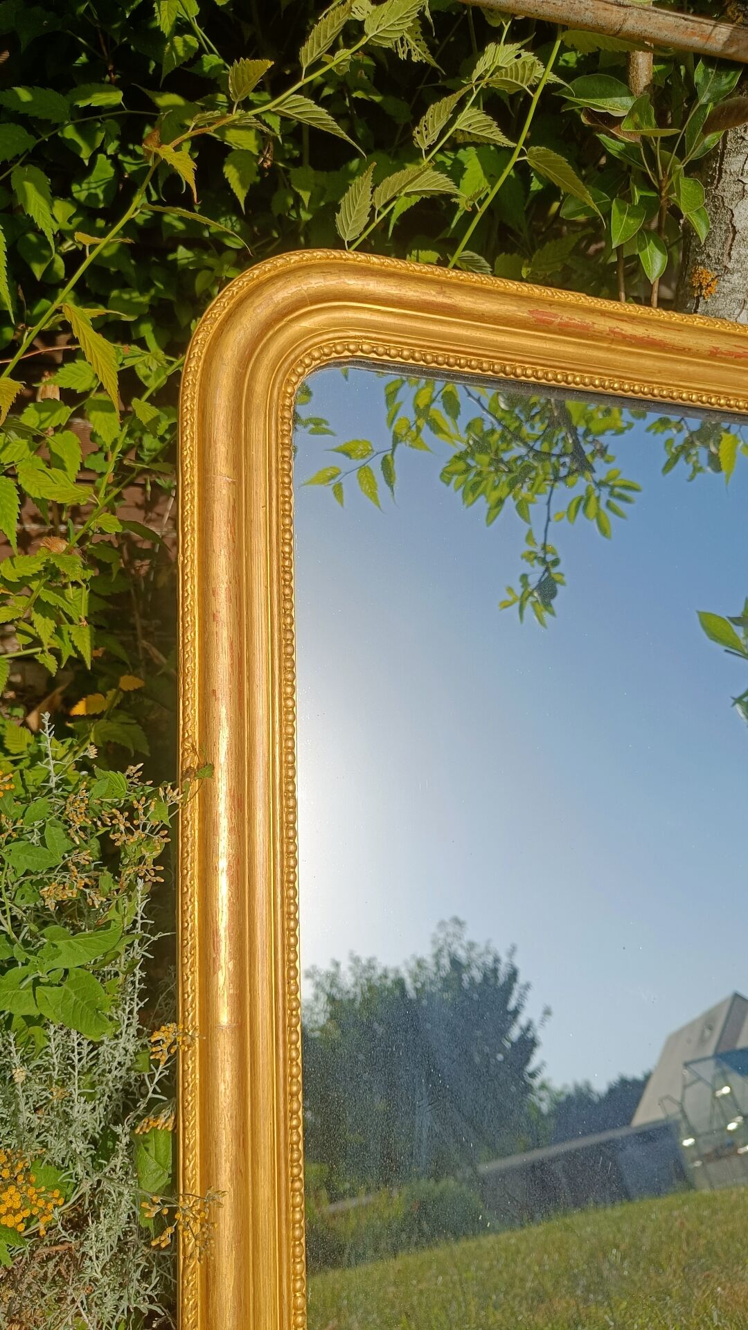 Antique gilded patinated Louis-Philippe mirror