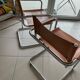 Stainless steel & leather armchairs