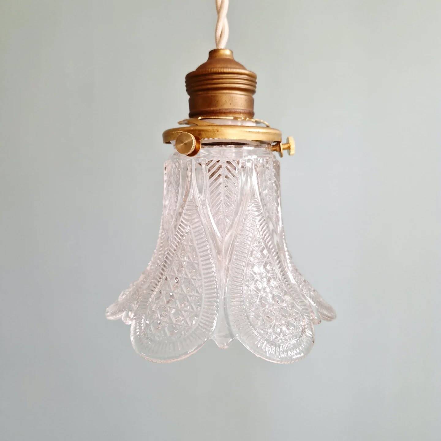 Art Deco trio of pendant lights/table lamps in clear glass, 1920s-30s.