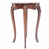 Table with a marble top, France, around 1910.