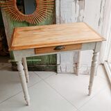 Antique wooden desk with a patinated base